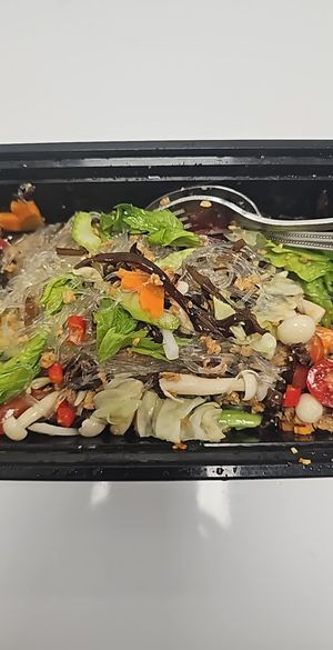 Yum Woonsen is glass noodles salad : Glass Noodle, Black Mushroom, White Beech Mushroom, White Onion, Cilantro, Celery, Pickled Garlic, Chilli, Lime at Gindee's Vegan - Maybe closed in San Antonio