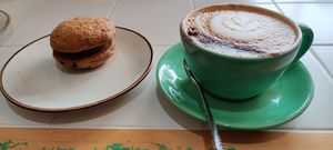 Cookie sandwich and cappuccino oat milk at Blow-In Coffee in Castlegregory