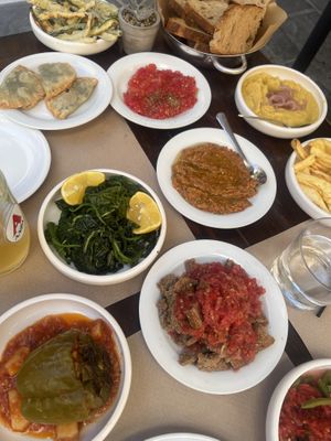 Fried zucchini, Cretan wild greenpies, tomato olive oil oregano for with bread, fava bean dip, aubergine pepper dip, fries, boiled greens, dakos and gemista (just out of photo)  at Vatsiko in Crete