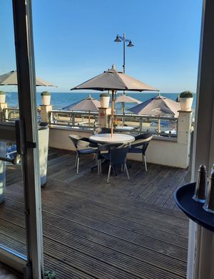 View of the terrace and the beach & sea beyond at The Reef in Sandown