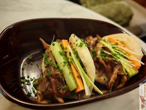 Peking-style buns, Le bao à la pékinoise (vegan) two homemade buns bao style, stuffed with shredded oyster mushroom, carrot, cucumber and leek, Chinese barbecue sauce. at Slow in Paris