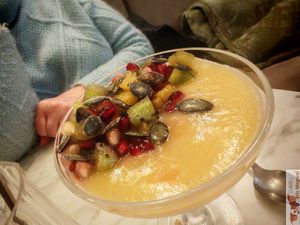 Coconut panacotta (vegan), with pear coulis, seasonal fruit, Thai basil at Slow in Paris