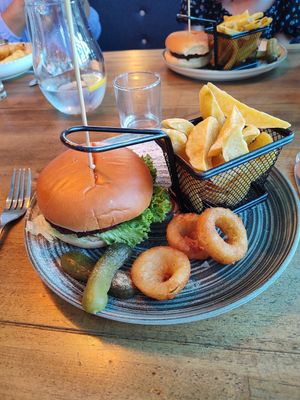 Moving mountains burger with chunky chips & onion rings. at The Seacroft in Holyhead