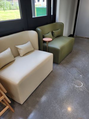 Sitting area outside the restrooms. at Just Falafel Vegan Cafe in Houston