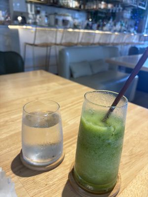 Mint lemonade.  Perfect balance—not to sweet, not too tart.  And check out the lovely glassware.    at Just Falafel Vegan Cafe in Houston
