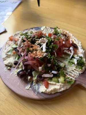 7 Layer Hummus Dip  at Just Falafel Vegan Cafe in Houston