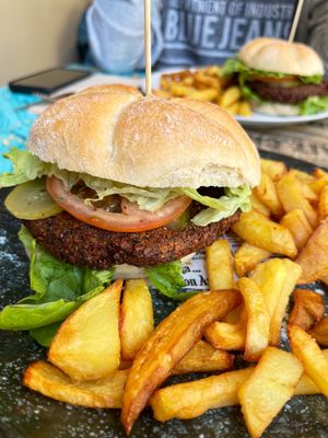 Vegan burger with falafel cutlet and fried potatoes. The hamburger was spicy but not bad! at Maus Food & Drinks in Oviedo