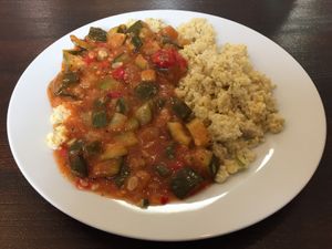 Vegan zucchini and tomato ratatouille type dish with millet at Szelence Cafe in Budapest