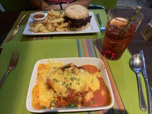 Vegan lasagna and vegan cheese burger    at La Perla Restaurant in Guernsey