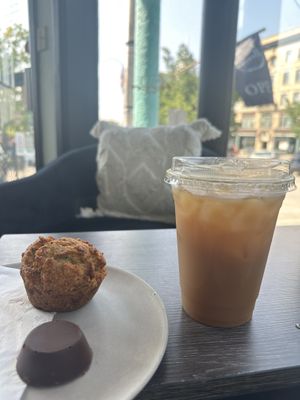 A super muffin with a vegan peanut butter cup and a cold brew coffee with oat milk and liquid sugar. Many vegan milk options for coffee - oat, coconut, and more.  at Riverwalk Bakery & Cafe in Nashua