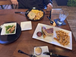 Above is country fried steak with tofu scramble and homestyle fries, fried green tomato appetizer to the left and the crunch wrap and seasoned fries on the rightt  at MoonShine in Cocoa