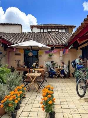 Mesas en jardín   at Hierba Santa in San Cristobal De Las Casas