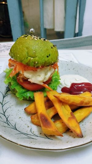 Tempeh burger with sweet potato fries. at The Seeds Plant-Based Foods & Desserts in Hoi An