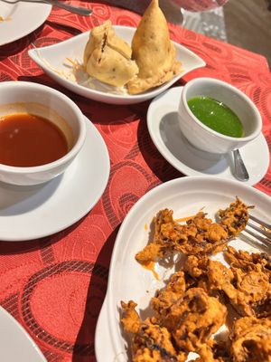 Huge portion of onion bhaji- made myself stop eating them so I would manage my main. I didn’t and took home a bit of both!  at Mother India in Kota Kinabalu