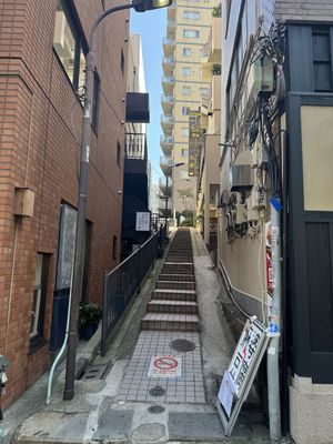 Enter this stairway and go up about halfwayy  at tsuminaki Mapo Tofu - 罪無き麻婆豆腐 in Tokyo