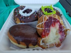 Fried donuts, Boston creme fried donut, and strawberry cream cheese Danish  at Reverie Bakeshop in Richardson