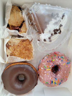 Berry and peach cobbler bar, gluten-free chocolate pie, sopapilla bar (AMAZING), strawberry and chocolate cake donuts at Reverie Bakeshop in Richardson
