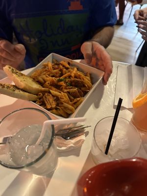 Penne pasta with sausage and garlic breadd  at The Modern Vegan in Royal Oak