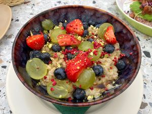 Oatmeal porridge with fruits and berries at Mimosa - temporarily closed in Juodkrante