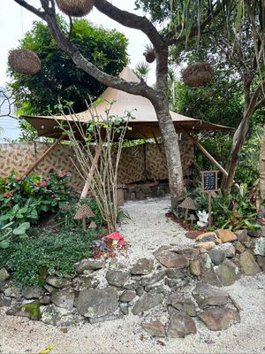 Our mystical fairy garden seating area is full of whimsical butterflies, flowers and secret fairy doors sweeping you away into another realm of delight! at MushBun Fairy Garden - Food Truck - Maybe closed in New Brighton