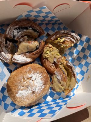 Almond croissant, cinnamon swirl, pistachio  at Okja in East London