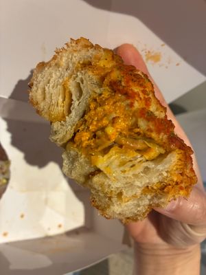 Inside of cheese and pesto swirl at Okja in East London