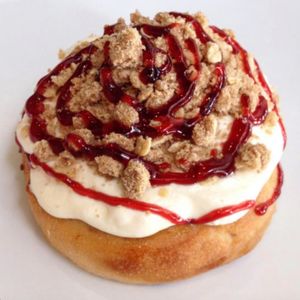 Jelly Donut Roll! Vanilla Frosting with House-made Pie Crumble and Raspberry Jam! at Cinnaholic in Madison