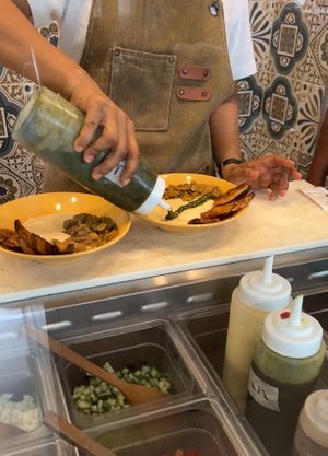 preparing our hummus  at Hummus Yossef in Koh Samui