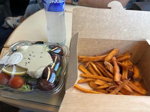 Falafel hummus salad and sweet potato fries (boniato) and I asked the guy to slip a falafel or two with it, but they are not allowed to really. But give it a try  at Como Express in Madrid