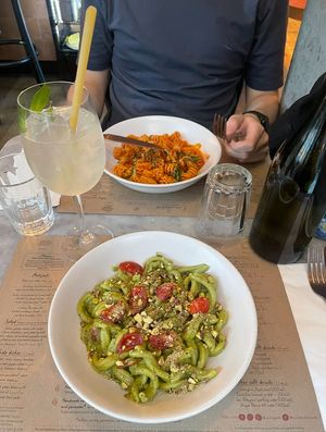 Homemade pistachio and basil pesto with sautéed cherry tomatoes (casarecce) and Homemade tomato sauce with freshly chopped basil (radiatori)  at Emilia's Crafted Pasta  in East London