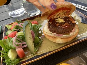 Vegan hamburger with a side salad   at Kerho in Tuusula