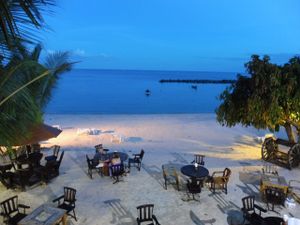 View to the tables on the beach. From a table in the first floor, at the evening... at Radiance Restaurant in Koh Samui