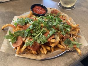 Fries w vegan pizza pizza toppings  at Riip Beer & Pizzeria in Huntington Beach
