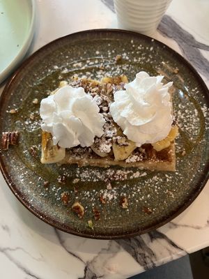 Pecan and banana waffle with coconut cream   at WaffleLand Cafe in Vancouver