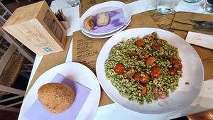 Arancino al ragù e piatto del giorno: orzo con pesto di rucola at Pasticceria Vegana Biologica La Magnolia in Verona
