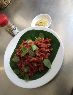 Red Devil Pasta served with Vegan parmesan cheese at Health Oasis Resort in Koh Samui