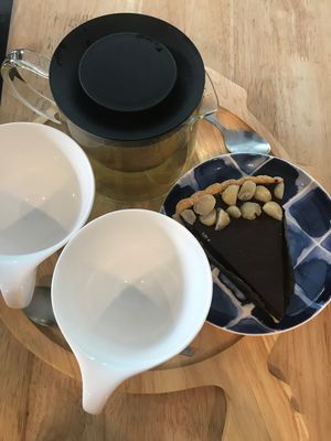 Macadamia tarte with free tea at Sunshine Market in Bangkok