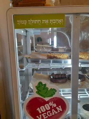 "Love Thy Cat" stiker at Meshigane in Zikhron Yaakov