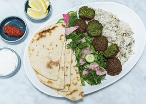 Falafel, rice, herb salad, and pita are all vegan    at Meli Wine & Mezze in Washington