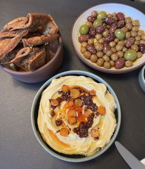 Marinated olive, hummus, and crispy pita are all vegan    at Meli Wine & Mezze in Washington