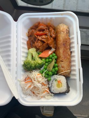 Buffet combination: spring roll, sushi roll, coleslaw salad, Soy meat with sauce and a variation of different Vegetables.   at Loving Bistro in Prague