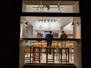 Looking through an outside window at Loving Bistro at Loving Bistro in Prague