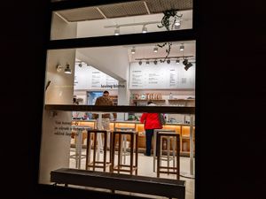 Looking through an outside window at Loving Bistro at Loving Bistro in Prague