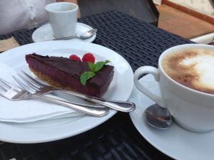Raw vegan fruit cake with chocolate topping and spelt caffeine free coffee with soy milk  at LoVeg in Prague