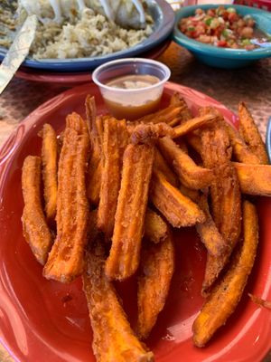 Sweet potato fries with caramel sauce! (not sure if the caramel is vegan) so, I just had the yummy fries. 🤷🏾‍♀️ at Oscar's Cafe in Springdale