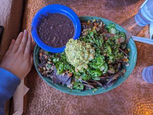 Muchos Nachos. No cheese. Add mushroom and rice. Hand for size reference. at Oscar's Cafe in Springdale