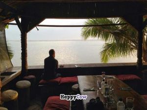 Eco Cafe seating area over the beach.  Owner built the bamboo structure himself. at Eco Cafe in Nadi