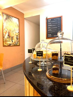 Drinks menu - Chai latte, ceremonial cacao, turmeric ginger and orange latte or noffee (coffee substitute). 
Choice of oat, almond or coconut milk. 
Good choice of vegan cakes.  at Govinda's in Swansea