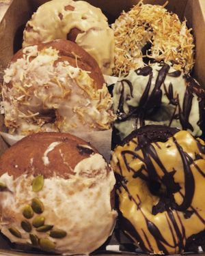 An assortment of their delicious donuts ^_^ Be warned: they are extremely filling (and obviously extremely tasty!!!), but they don't last too long. So if you're getting a good sized box like this, be sure you have a good crowd to share them with. at Through Being Cool Vegan Baking Co. in Toronto