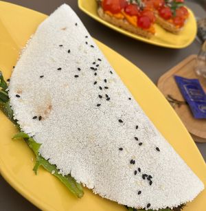 Tapioka crêpe with avocado, tomatoes, salad and balsamic glazee  at Yellow Bourbon in Faro